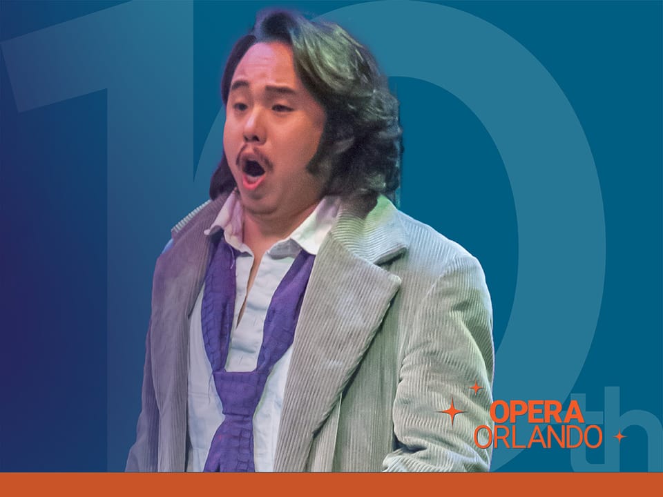 A man sings while in background is a graphic that reads “10th”. In bottom right hand corner reads the words “Opera Orlando.”
